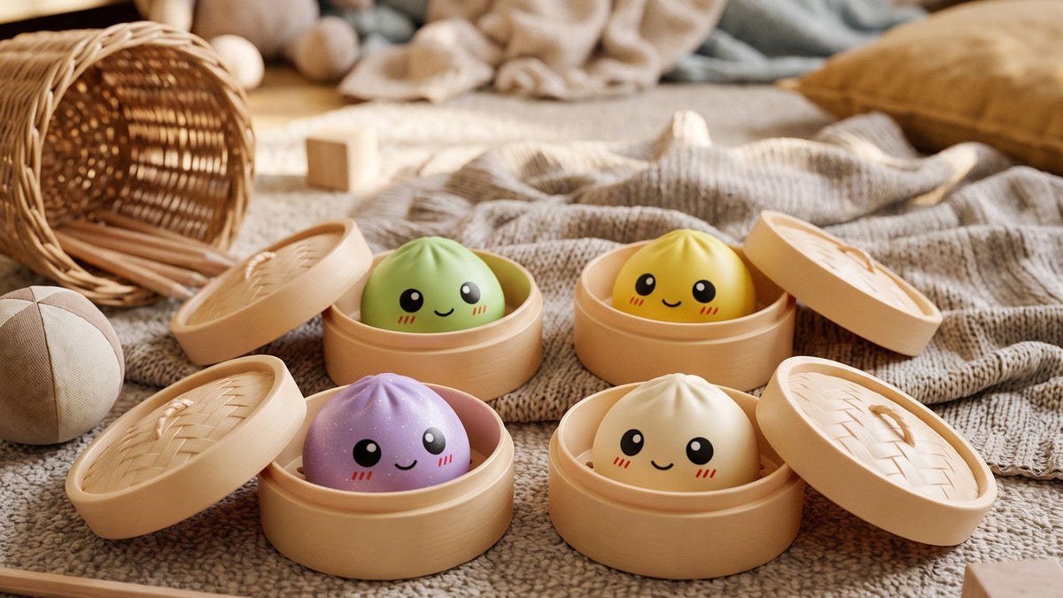 Four dumpling squishy designs sitting in their open steamer baskets on a knitted blanket