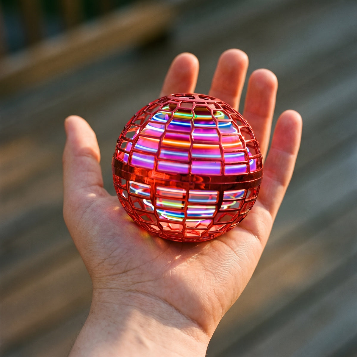 Close-up of the flying orb ball's lattice shell and the coloured lights inside it