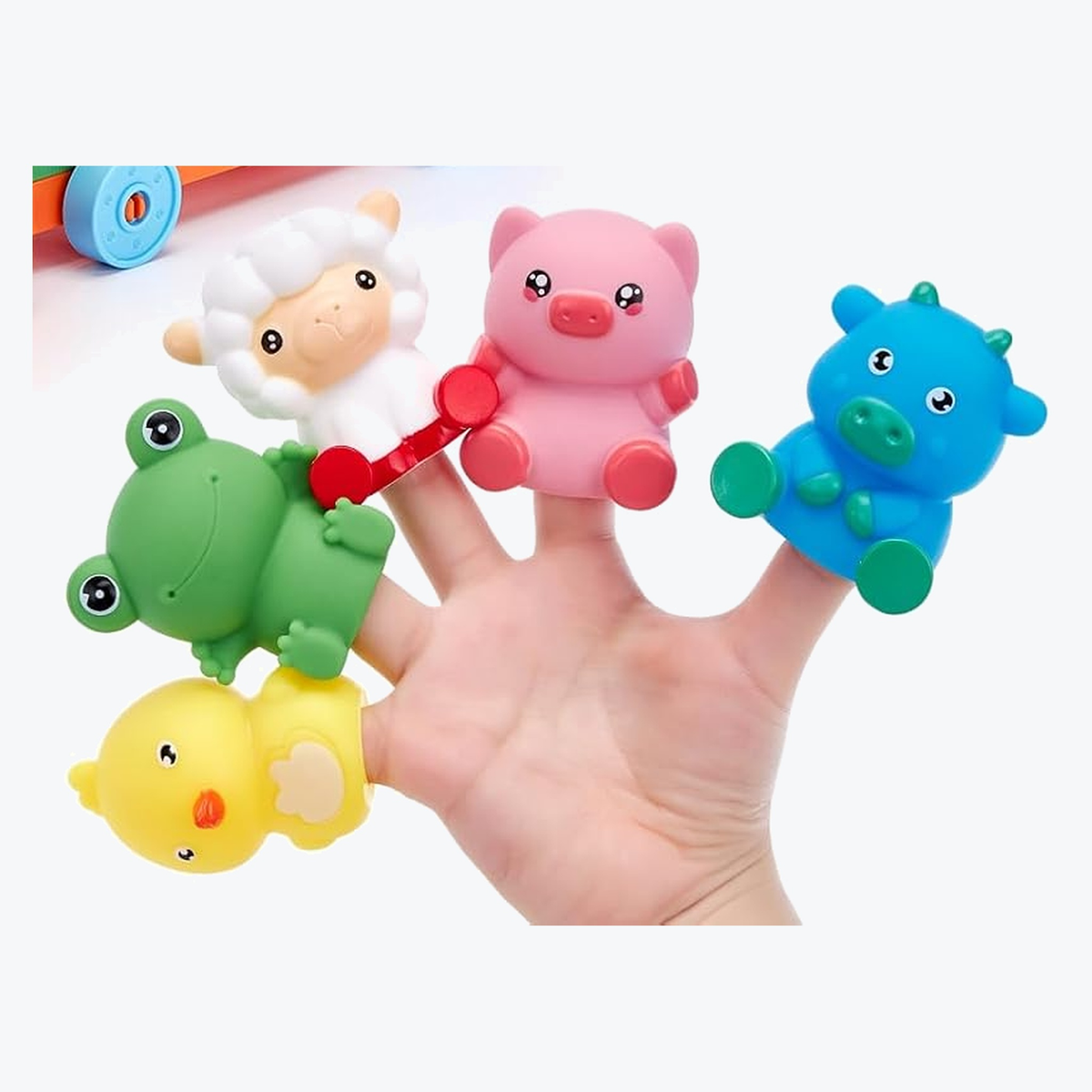 Five farm animals from the set worn as finger puppets