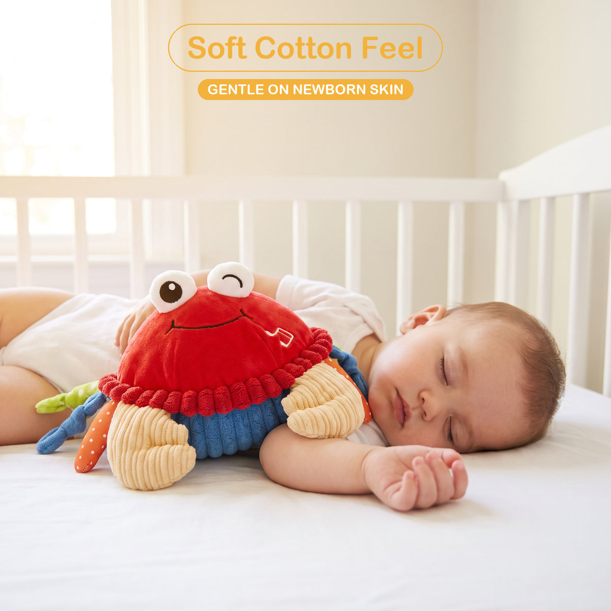 Baby asleep in a white crib next to the soft cotton musical crab plush toy