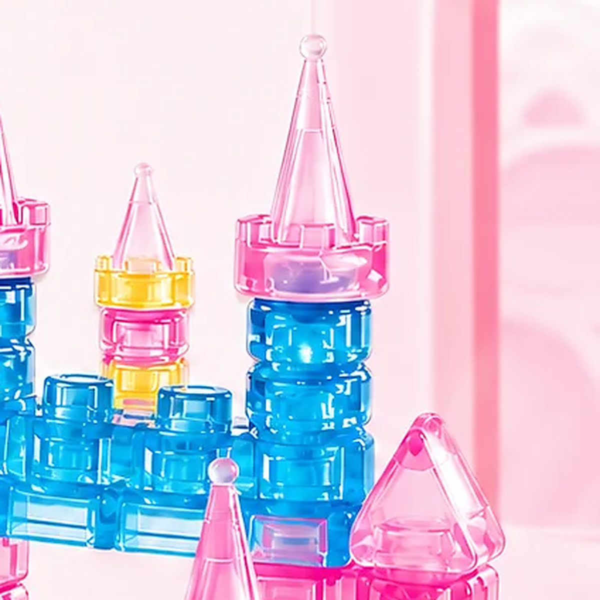 Close-up of a spire seated in a magenta battlement crown