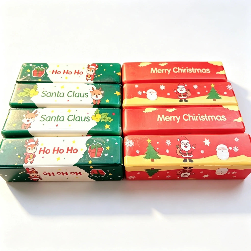 Christmas butter squishies lined up: green Ho Ho Ho and Santa Claus, red Merry Christmas