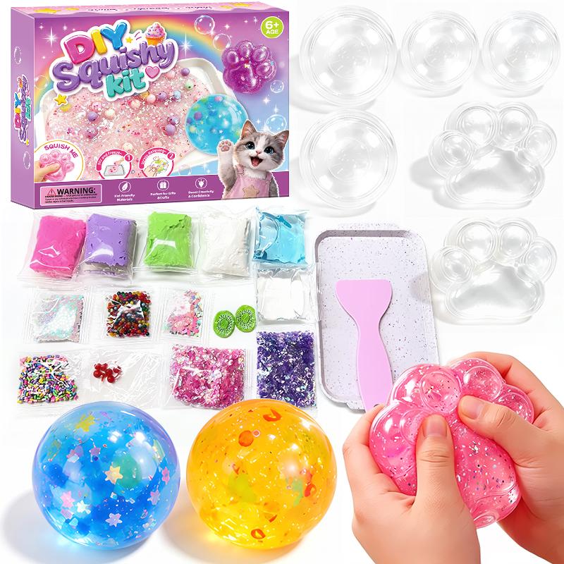 DIY cat paw squishy kit box with the six moulds, gel, clay, glitter and beads laid out