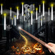 White floating candles lit above a dark staircase with jack-o-lanterns and a wand