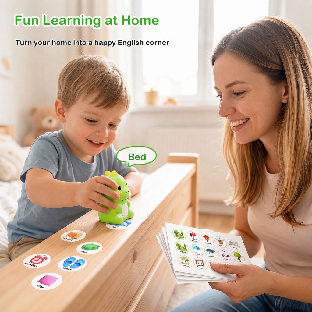 A toddler sets the green dinosaur reader on a bed rail covered in picture stickers while his mother holds a sheet of stickers, with the word Bed in a speech bubble