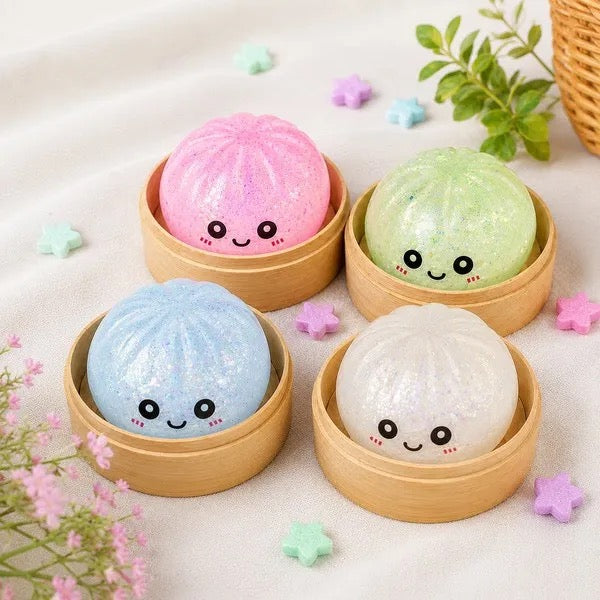 Glow dumpling squishies resting in their bamboo steamer tins in daylight
