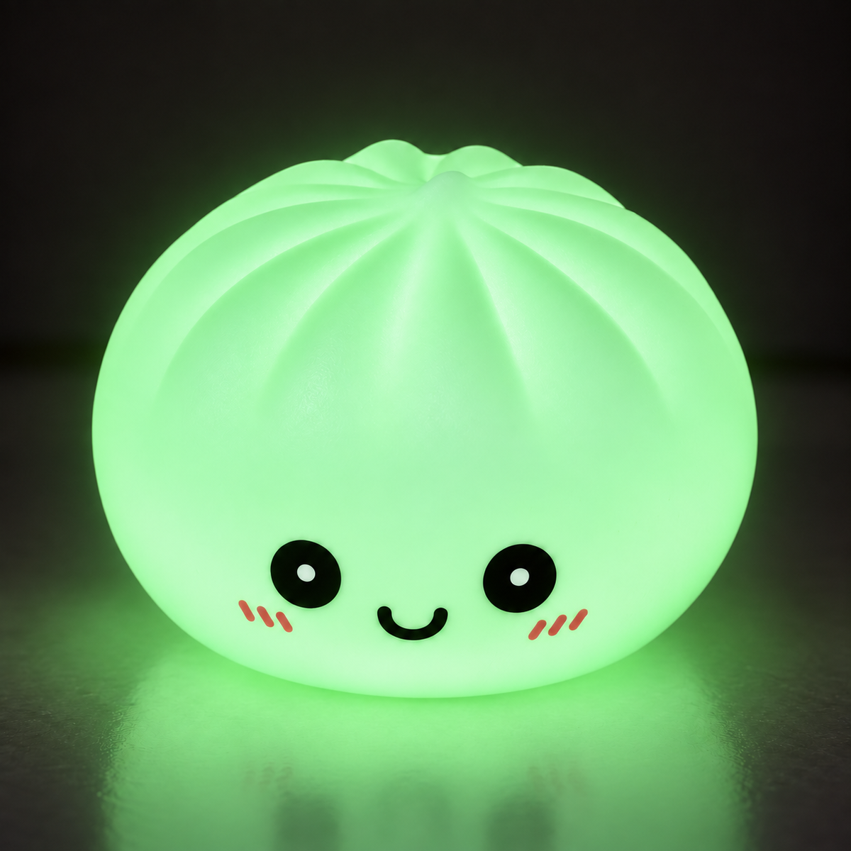 Green glow dumpling squishy shining in a dark room