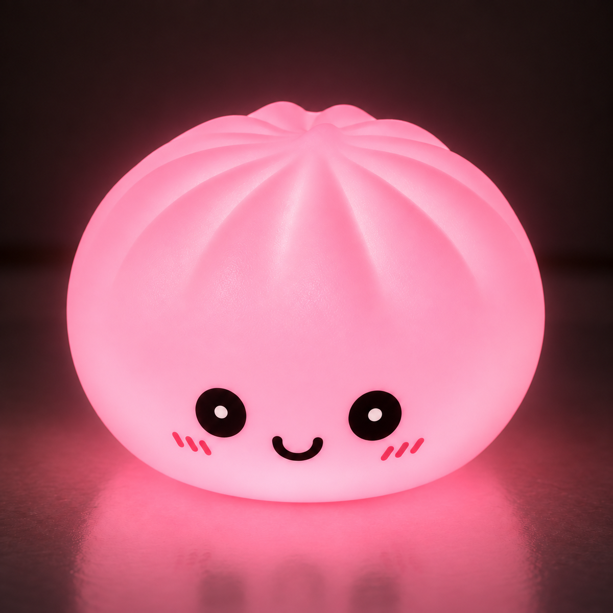 Pink glow dumpling squishy shining in a dark room