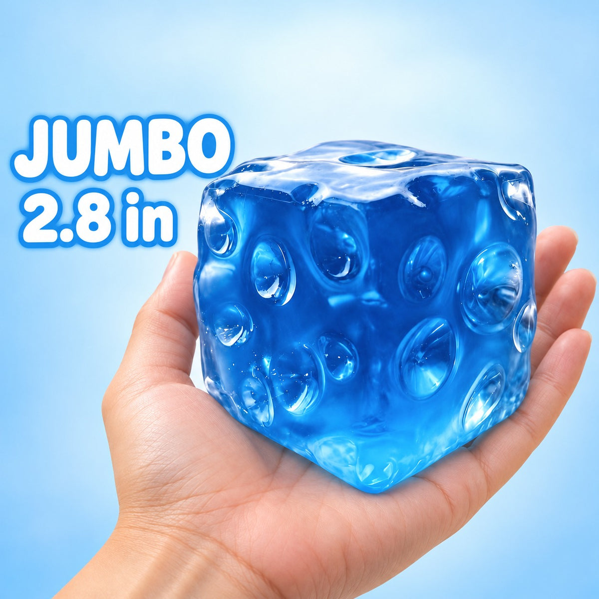 Jumbo blue jelly cheese cube squishy, 2.8 in, resting in an open hand