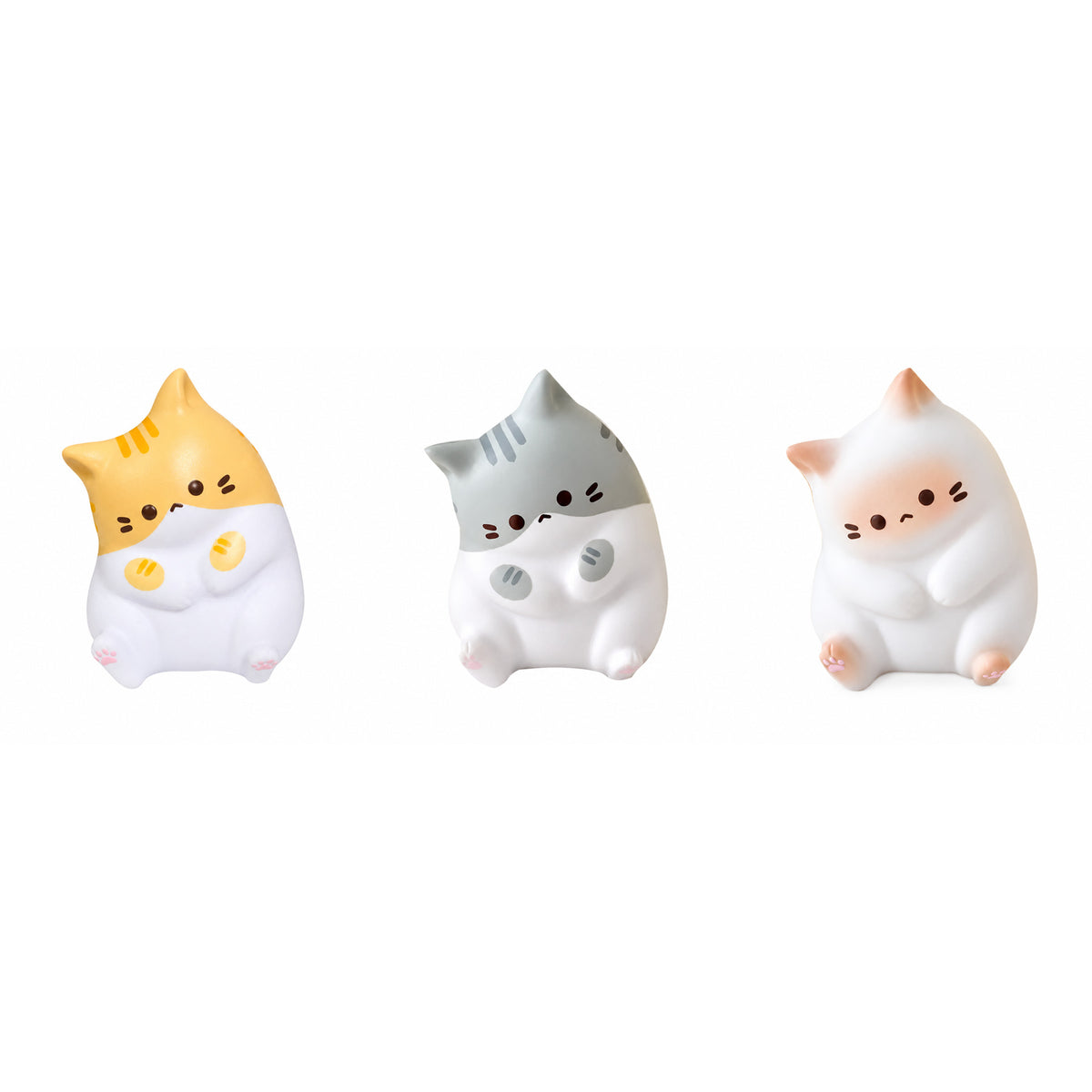 Kawaii cat squishy in orange, grey and white side by side