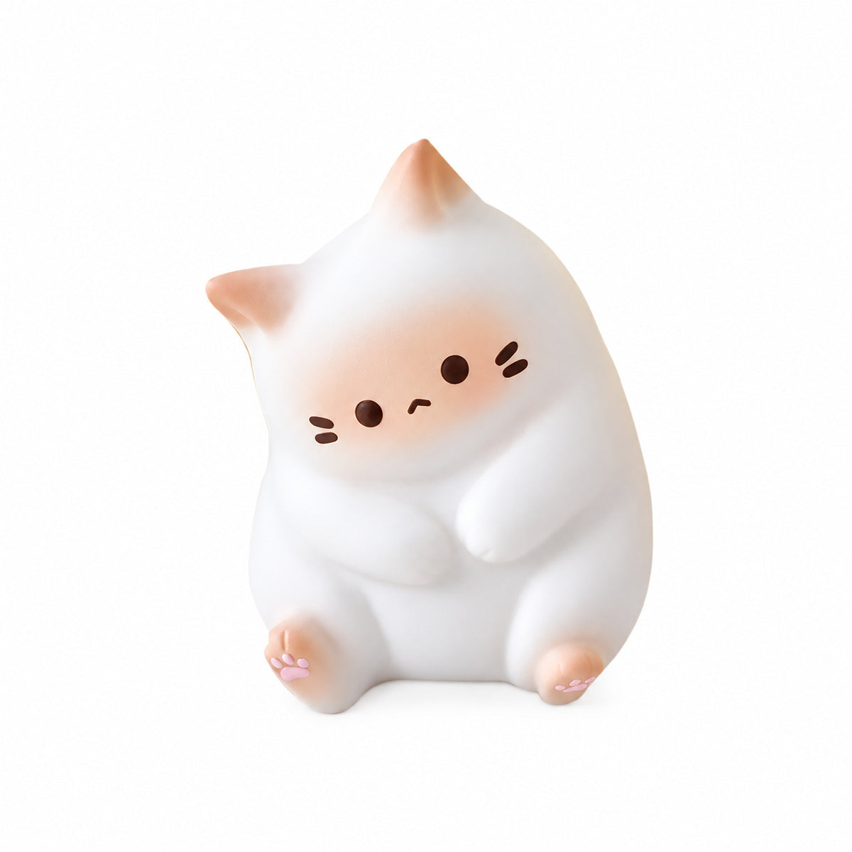 White kawaii cat squishy with peach cheeks sitting up, white background