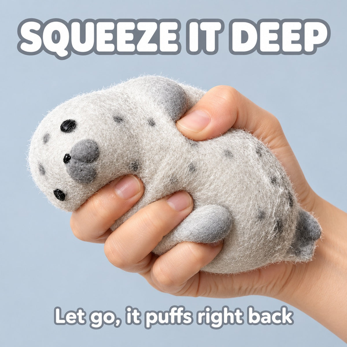 Hand squeezing the grey fuzzy seal squishy deep, text Squeeze it deep