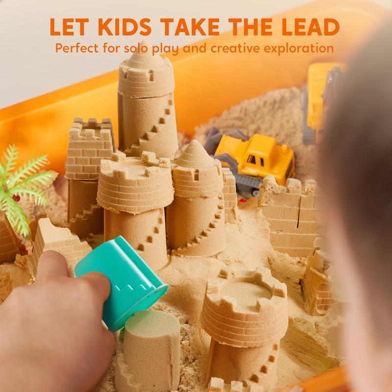 Child pressing a castle mould into the kinetic sand next to a toy digger