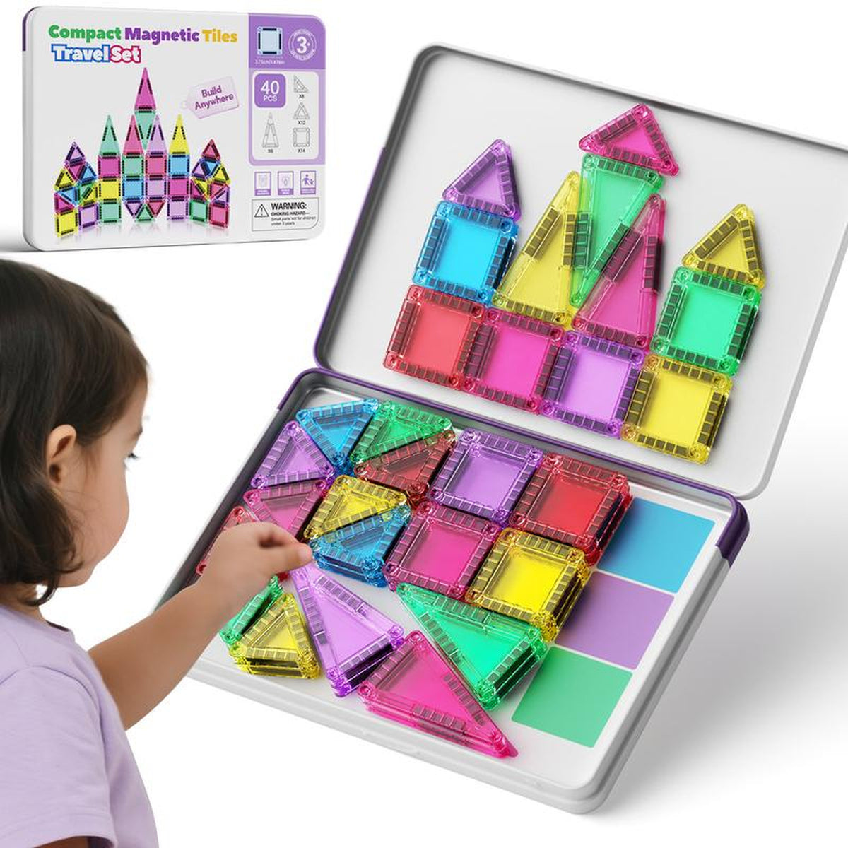 Mini Magnetic Tiles 40-piece travel set in its metal tin case, girl building with translucent square and triangle tiles