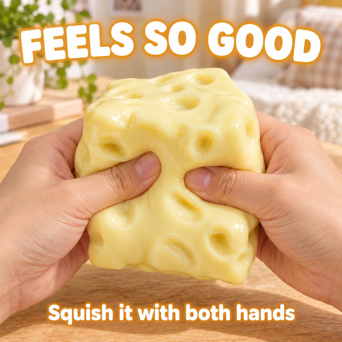 Two hands squeezing the yellow moldable cheese squishy: feels so good, squish it with both hands