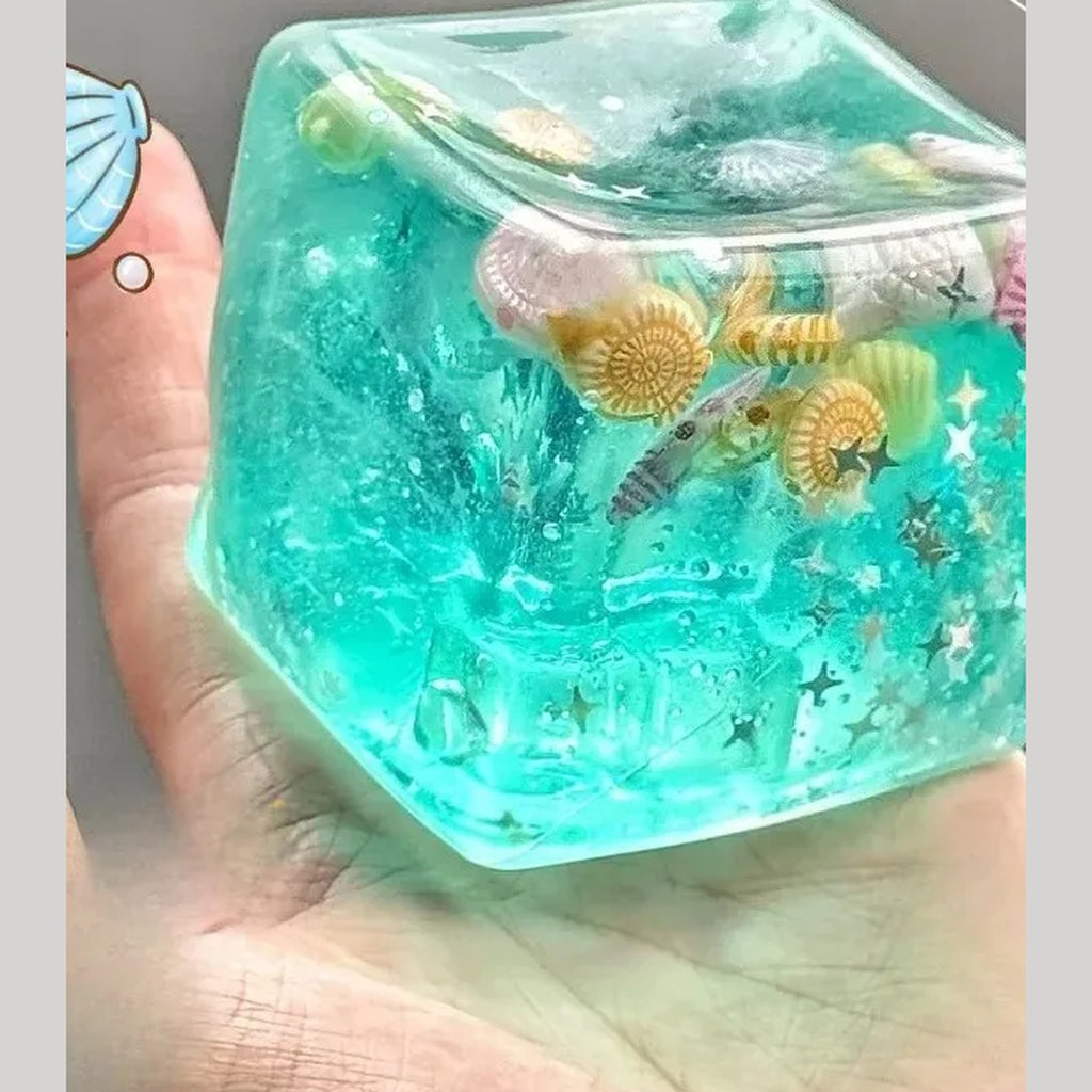 Ocean ice cube squishy held in a hand