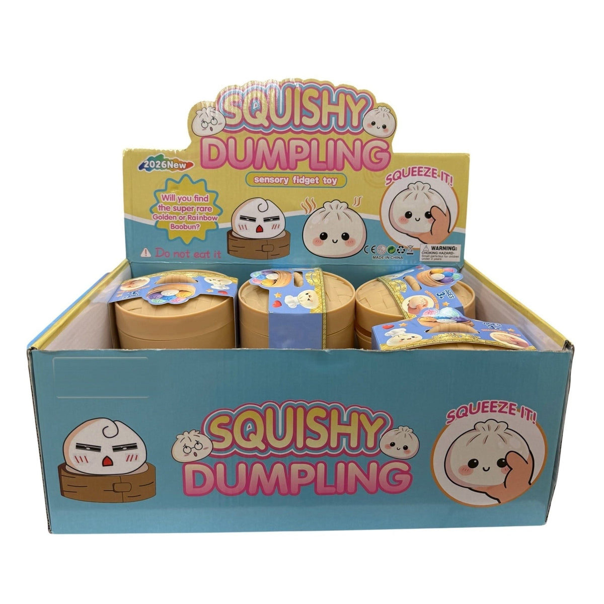 The Squishy Dumpling retail display box open on a white background, twelve bamboo-steamer capsules inside, each wrapped in its own blind-box sleeve