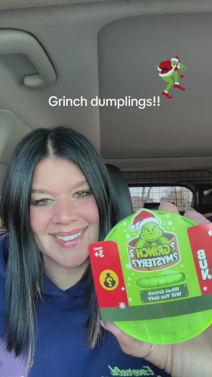 A creator opens a sealed Grinch Dumpling pot and reacts to the glitter squishy inside
