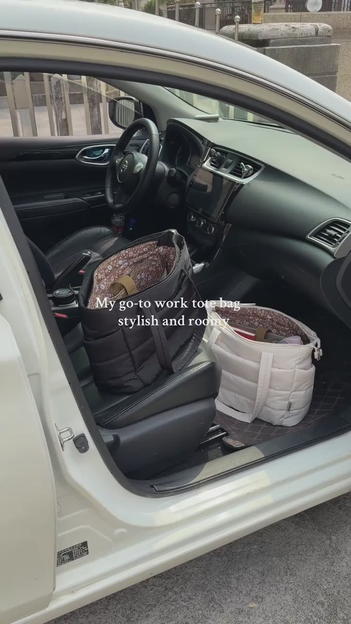 Grey puffer tote bag loaded and carried out to the car