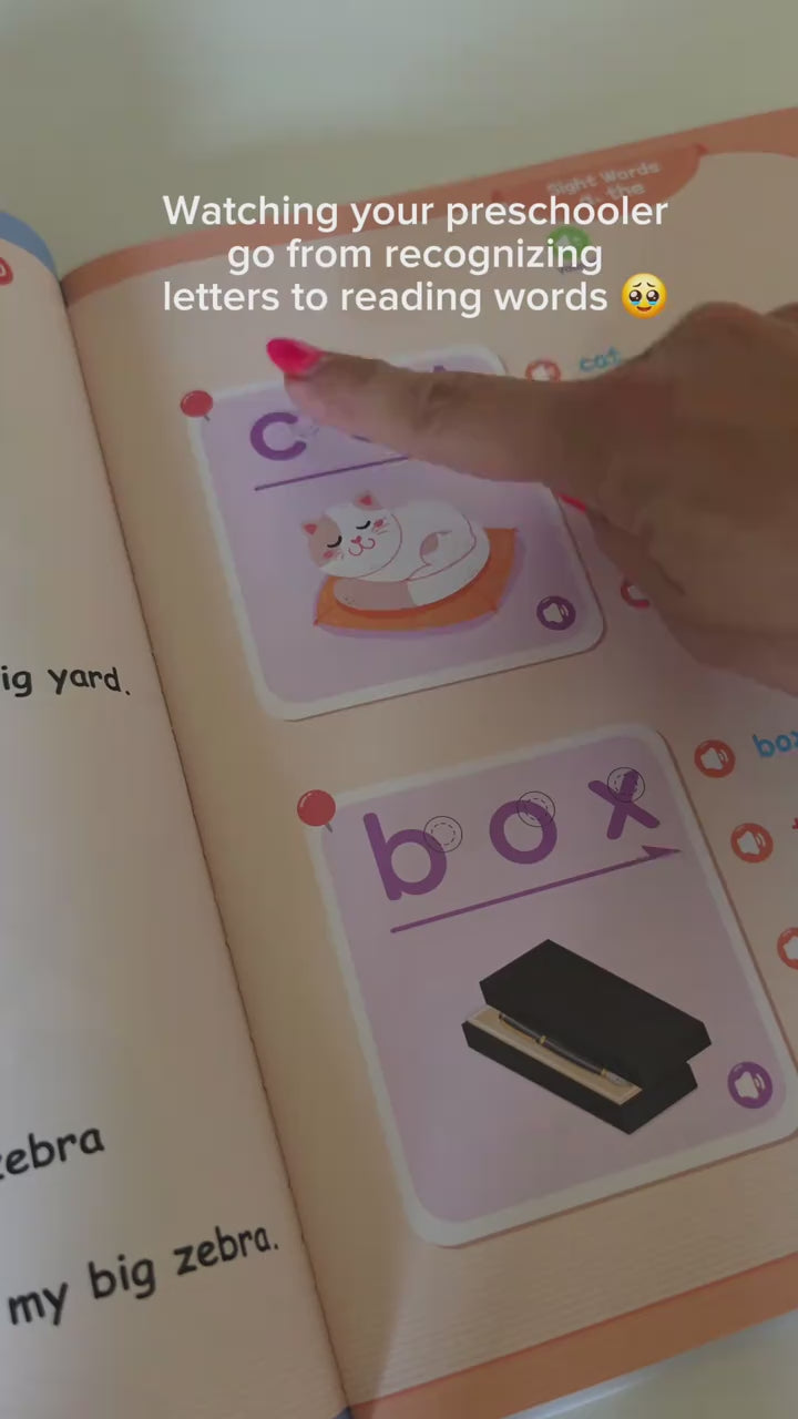 A mother pressing the words in the talking phonics book