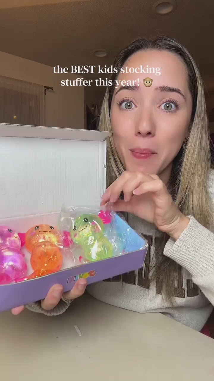 Mom unboxing the axolotl squishy 4-pack for stockings