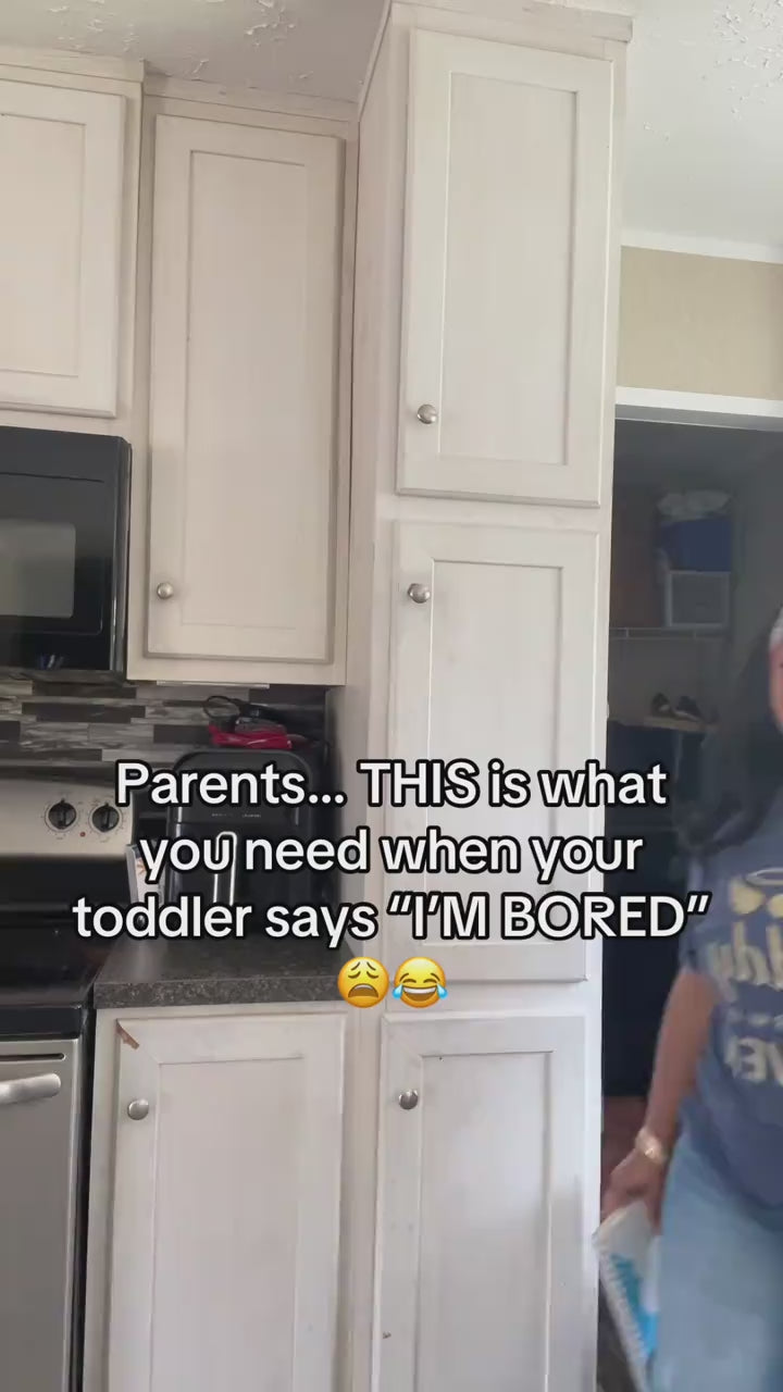 A toddler working through the matching pages on his own