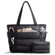 Black puffer tote bag with its matching pouch, packed with a magazine, sunglasses, a phone and a water bottle in the side pocket
