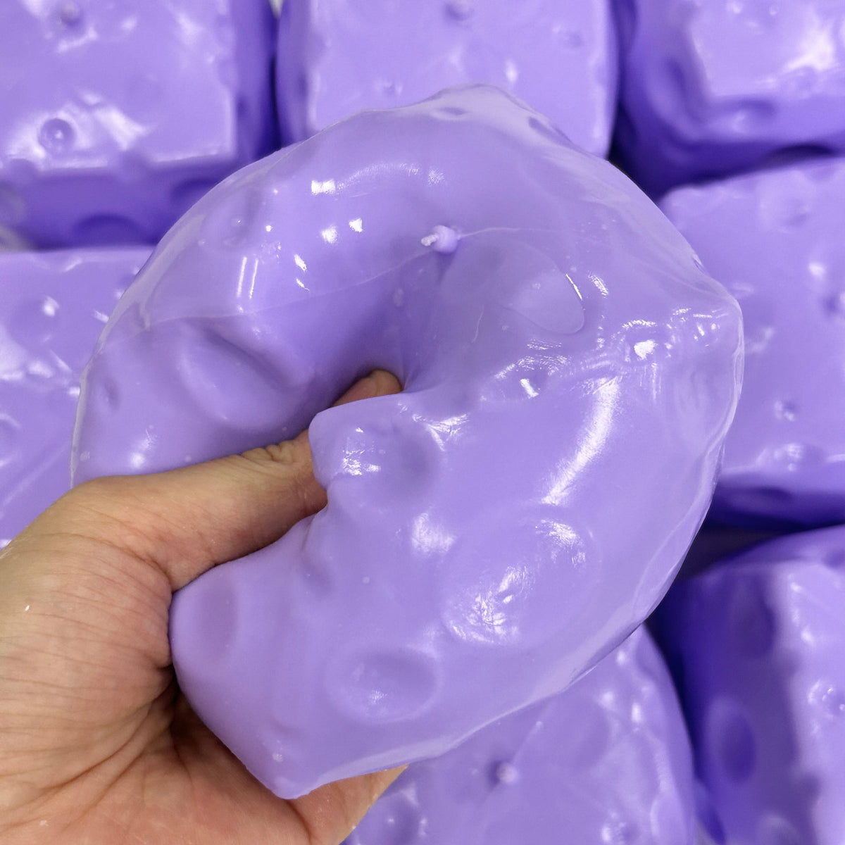 Purple cheese squishy squeezed, holding its shape