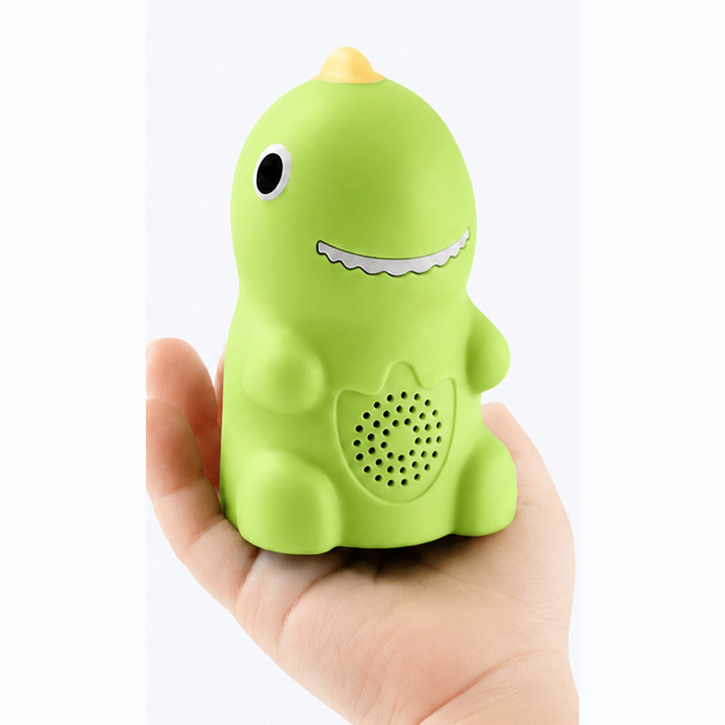 The dinosaur reader held in a hand, small enough to fit in one palm, with the speaker grille on his belly