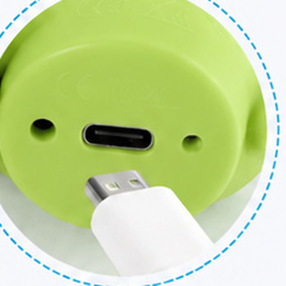 The underside of the dinosaur reader: the USB-C charging port, two small openings and the moulded markings