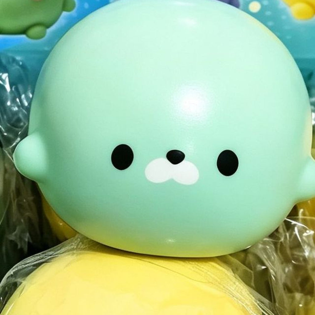 Matcha green seal squishy, close up on its face