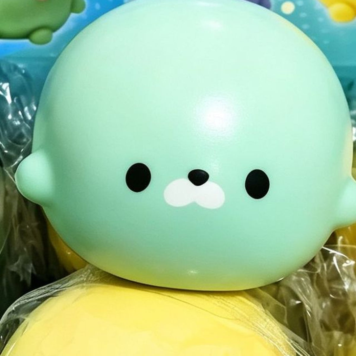 Matcha green seal squishy, close up on its face
