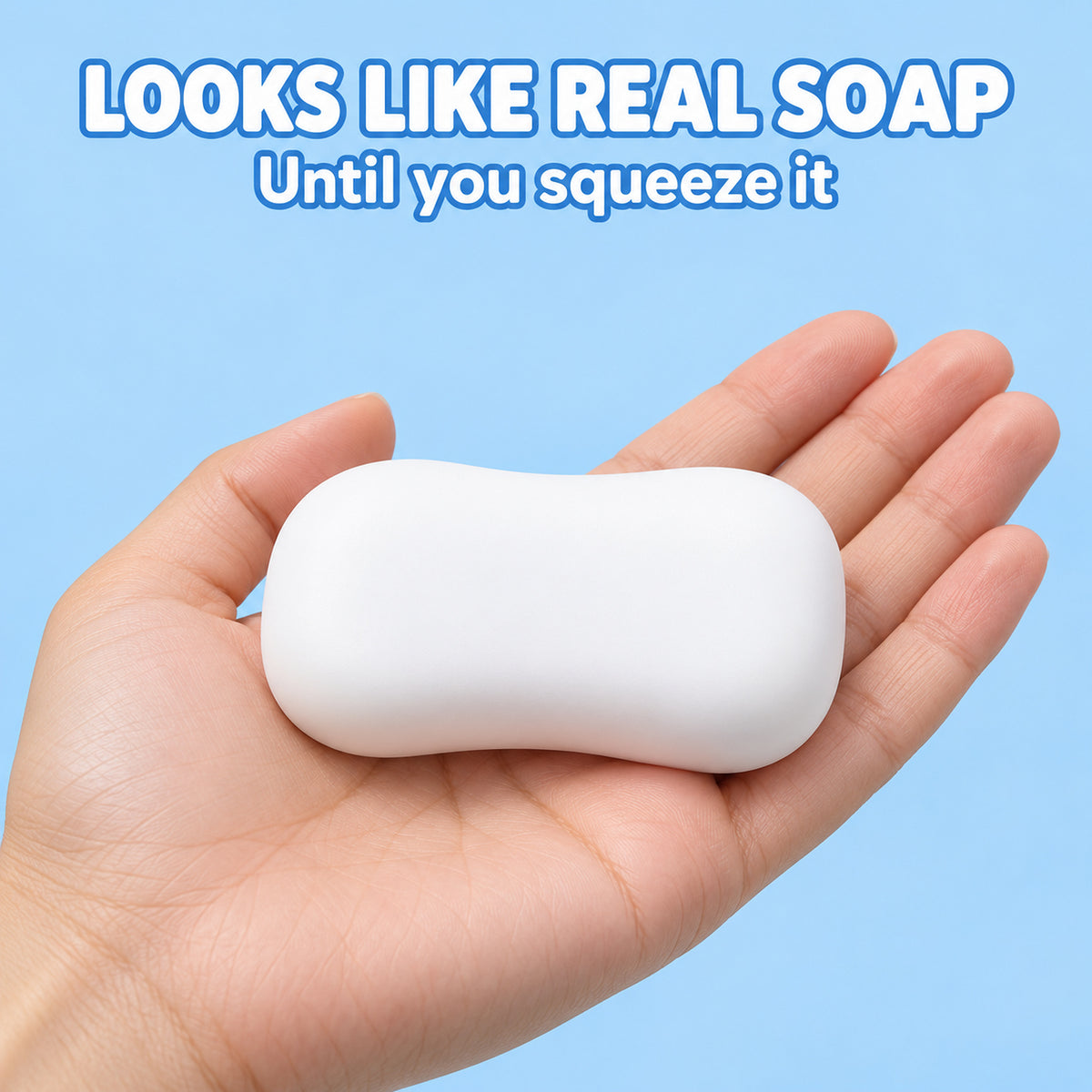 White squishy soap bar resting in an open hand: looks like real soap until you squeeze it