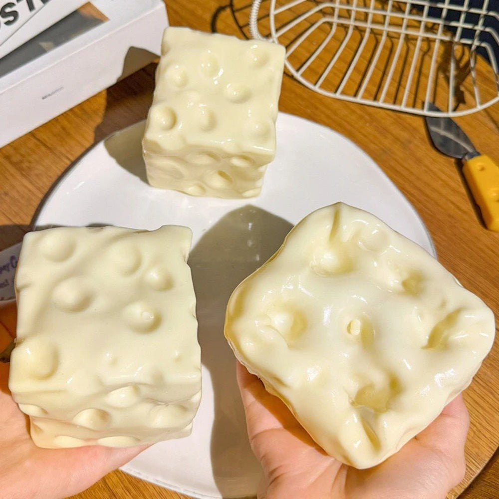 Three yellow cheese squishy blocks